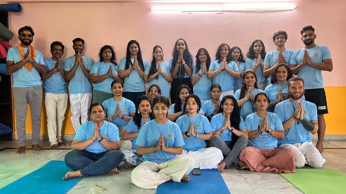 Students practicing yoga in Rishikesh