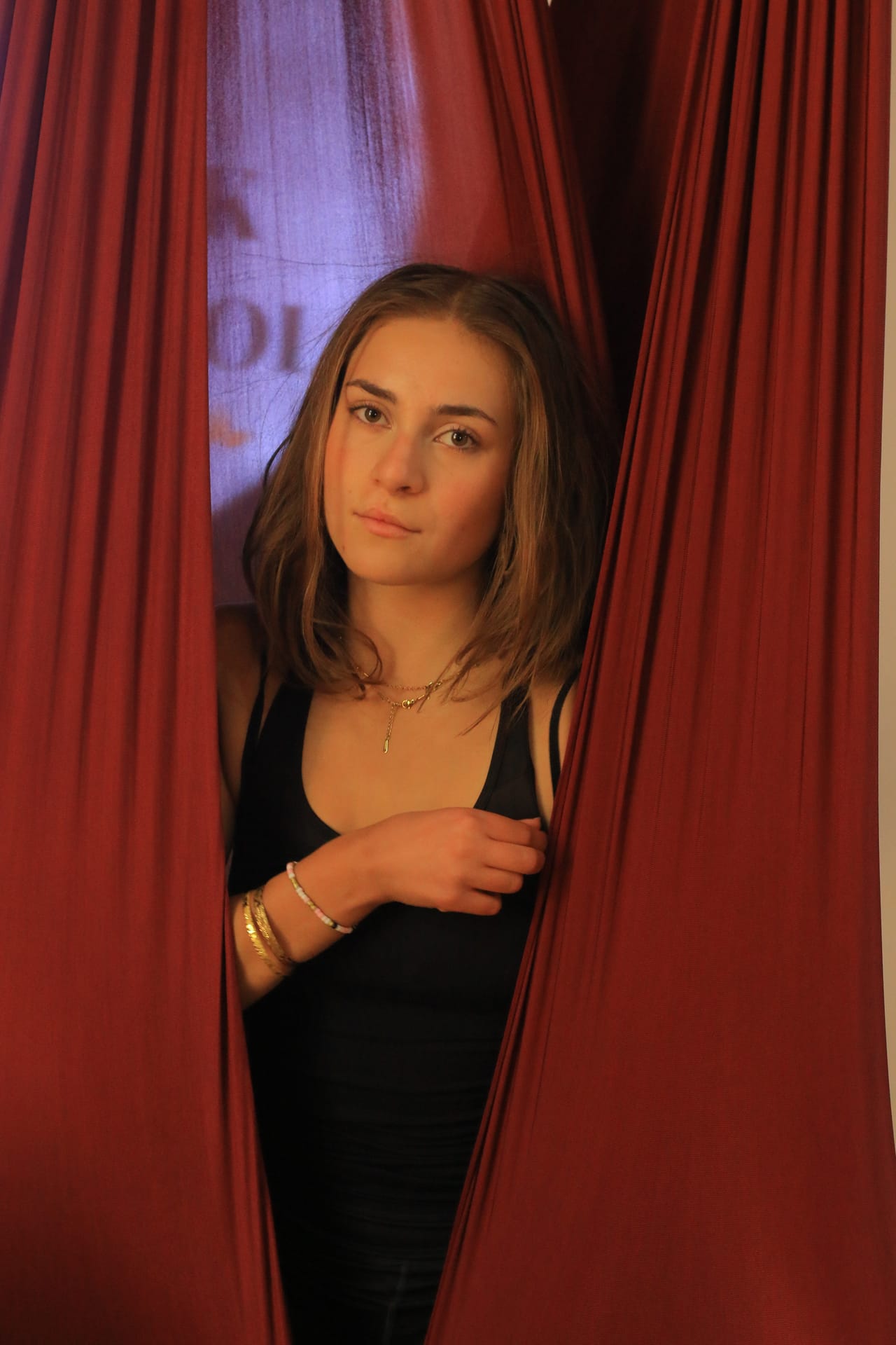 Aerial yoga instructor guiding students