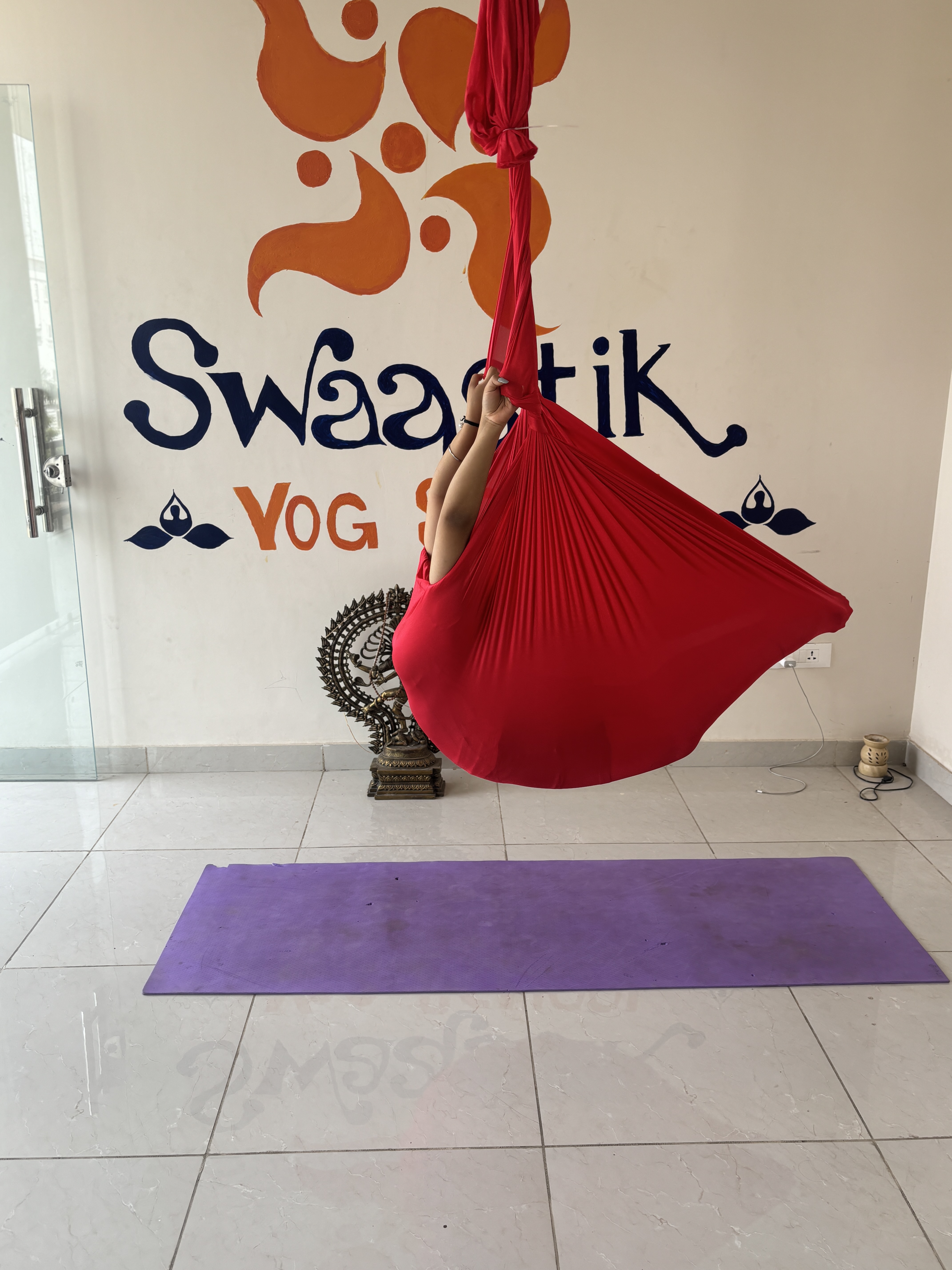 Outdoor aerial yoga session